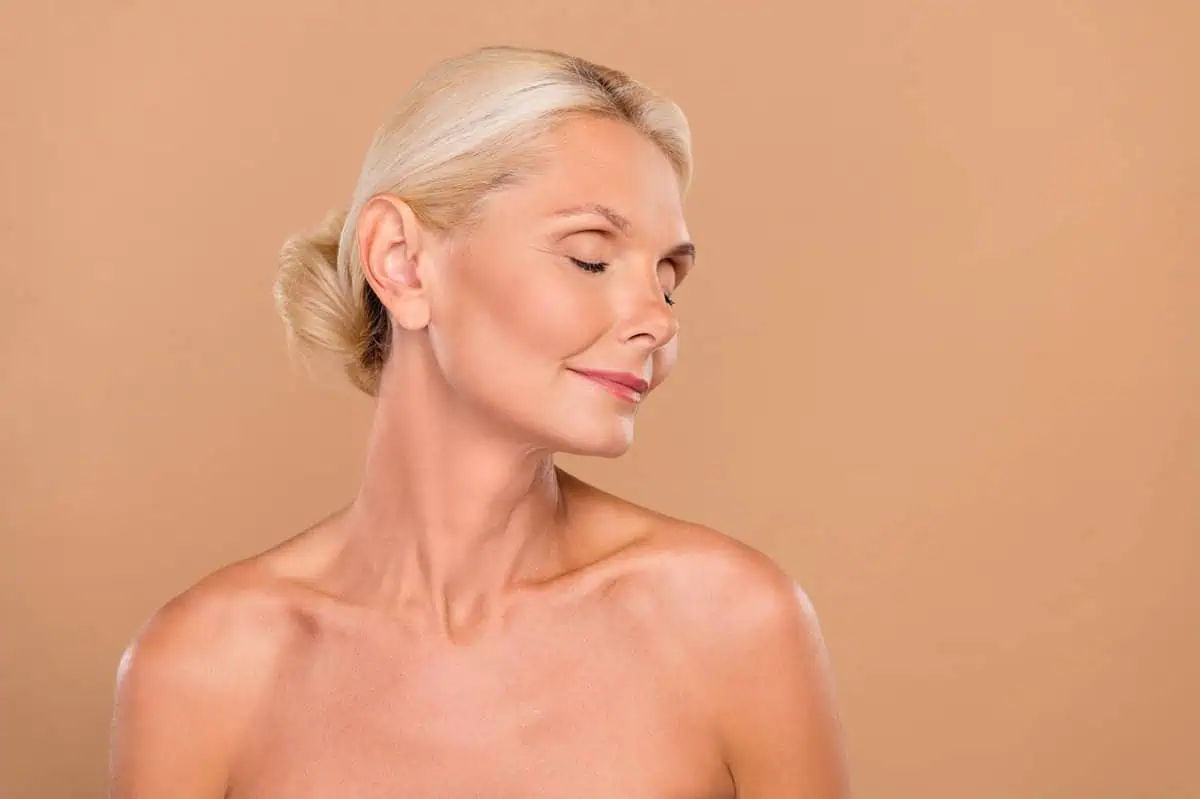 Mature woman showcasing anti-aging skincare results in Niceville, FL | Blissful Beauty Bar
