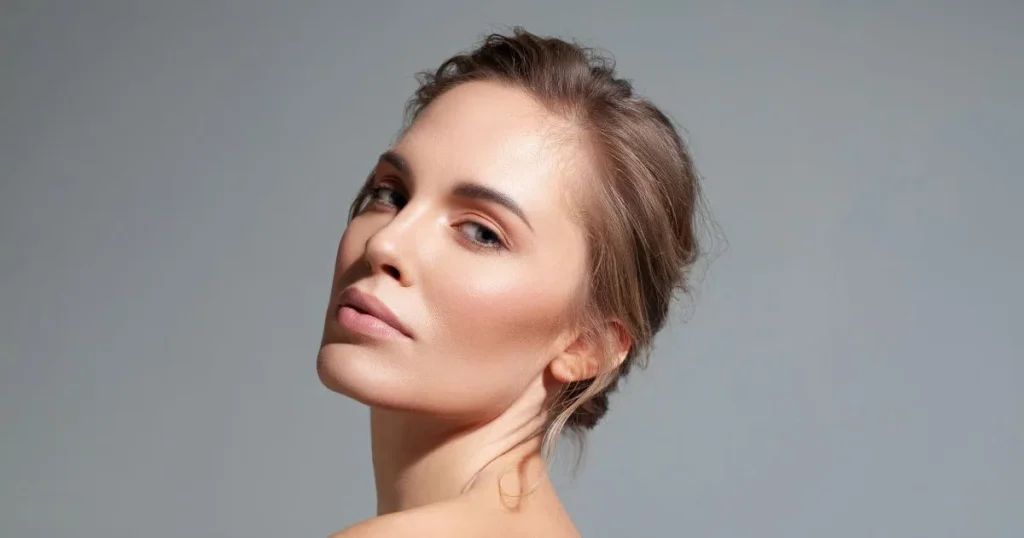 A close-up of a woman's face, emphasizing her clear, glowing Facial skin in Niceville, FL